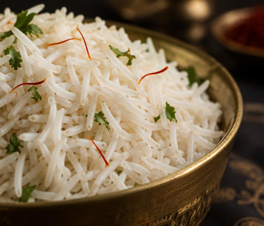Long grain basmati rice in a brass bowl